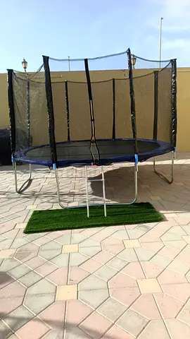 6ft Outdoor Trampoline with Safety Net and Ladder - Good Condition