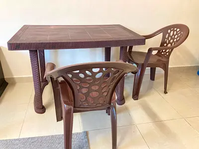 Plastic table and chairs 75 AED