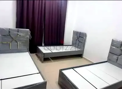 Brand new bedroom set - 2 single beds with headboards and bedside table (still wrapped)