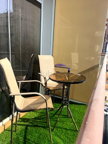 Outdoor table and chairs for sale.