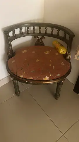 Antique-style wooden accent chair with floral upholstery