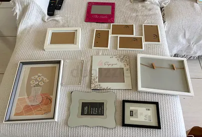 Mixed picture frame collection — assortment of sizes, white and neutral tones