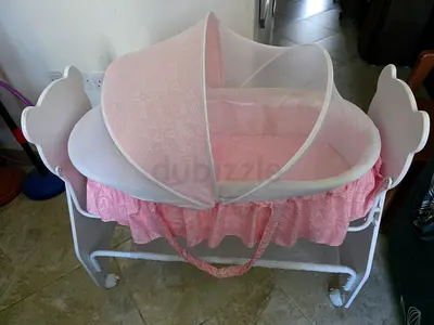 Comfortable Rocking Pink Baby Bassinet with Mosquito Net and Wheels