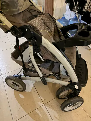 Used 4-wheel baby stroller / pram in good working condition