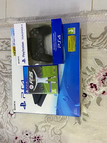 PlayStation 4 Slim bundle with DualShock 4 controller and FIFA 25 (good condition)