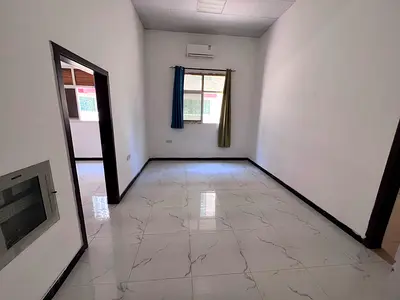 A great opportunity for annual rent in Al Muwaihat 3, Ajman: a spacious ground-floor one-bedroom apartment with a practical design that offers comfort