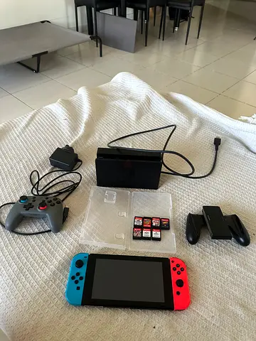 Nintendo Switch console with dock, Joy-Cons, Pro controller and 7 game cards