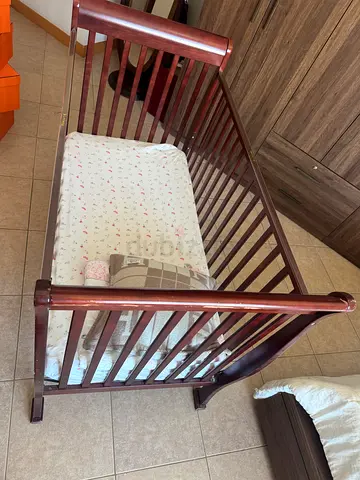 Wooden Baby Crib / Rocking Cradle in excellent condition plus mattress and its cover