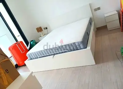 Ikea king size hydraulic bed with mattress available in perfect condition
