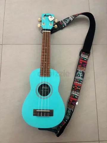 Ukulele - Kala Ukadelic with patterned strap and pick - condition like new