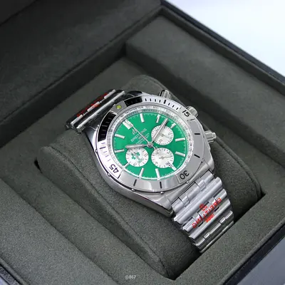 Mens stainless steel chronograph watch with green dial