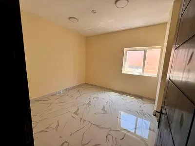 One bedroom apartment with living room for annual rent in Al Bu Tina Spacious layout modern finishing prime location with open view