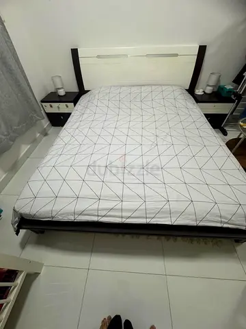 Queen bed frame with headboard and two bedside tables -and dresser. good condition