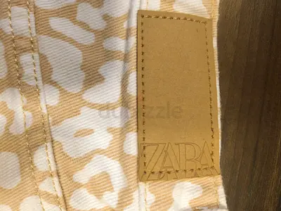 Brand new Zara beige white patterned shorts with leather logo tag -and Zara blue jeans. Never used