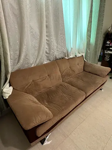 Brown 3-seater sofa bed with wooden frame, good condition