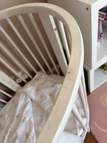 Stokke White wooden baby crib that convert into toddler bed with baby and toddler mattress included