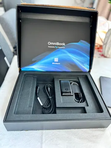 OmniBook laptop (boxed) with charger and accessories