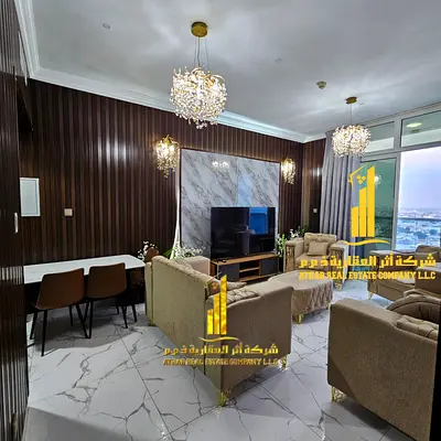 With a sea view. Luxurious two-bedroom apartment with a living room and balcony. Ajman, Oasis Tower. Fully furnished for monthly rent.