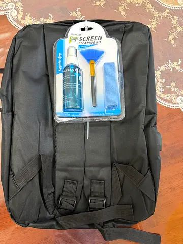 Simple black backpack with screen cleaning kit