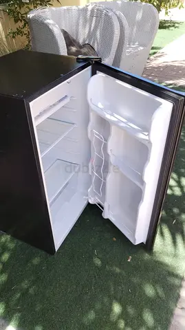 Compact black single-door refrigerator in good working condition