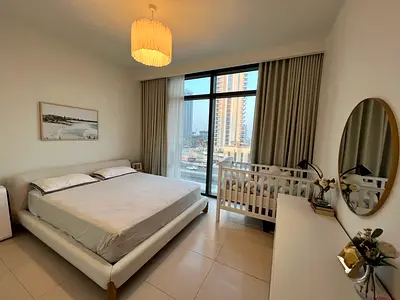 Minimal Beige Upholstered Bed with Wooden Nightstand and Rug