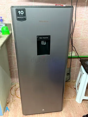 Silver single-door refrigerator with water dispenser - good condition
