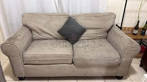 2-seater beige fabric sofa — used, good for living room