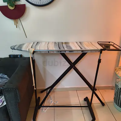 Sturdy adjustable ironing board with cover - good condition
