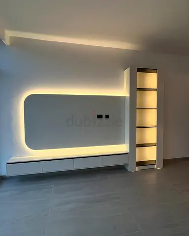 Modern built-in entertainment wall unit with LED shelving
