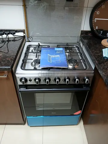 Midea four burner full gas cooker size 60cm new condition