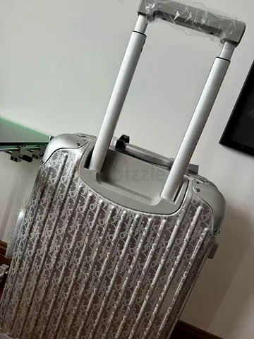 Dior and Rimowa aluminum luggage