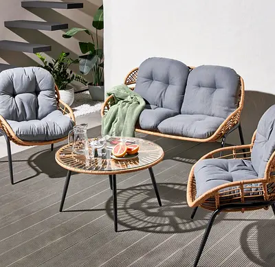 Outdoor balcony set with two chairs and small tables on artificial turf