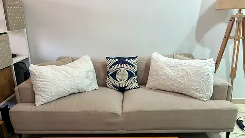 Light beige 2-seater fabric sofa in good condition