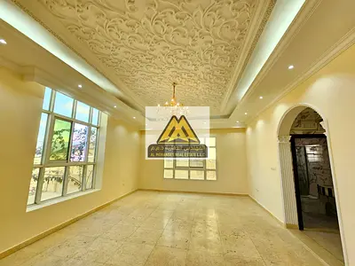 Very Large Layout | 5 Master Bedrooms | 2 Living Rooms | Majlis | Spacious Kitchen | Maid Room | Outdoor Yard | Prime Location in Al Mowaihat