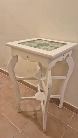 White wooden side table with decorative tile top