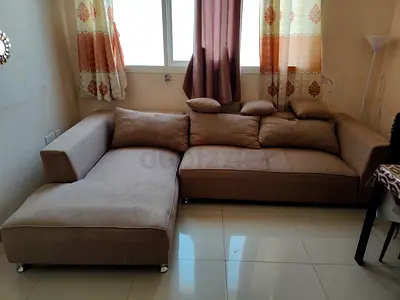 Used L-shaped beige fabric sofa with chaise (4-seater)