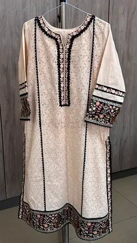 Peach color Chikankari shirt and trouser from brand Kayseriya.