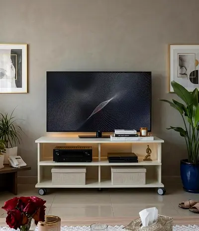 This white IKEA Benno TV media stand features a multi-tiered open shelf design and roller legs