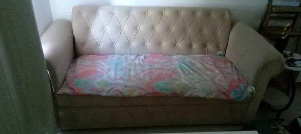 Beige 3-seater sofa with tufted back — good condition