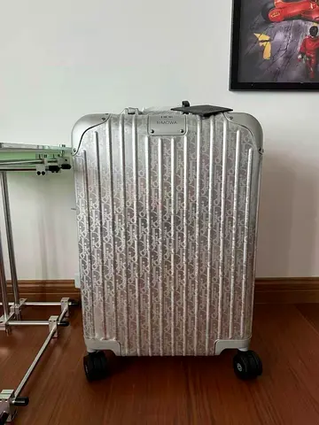 Dior and Rimowa cabin suitcase