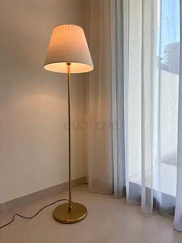 Brass floor lamp with pleated white shade - gently used. Ikea