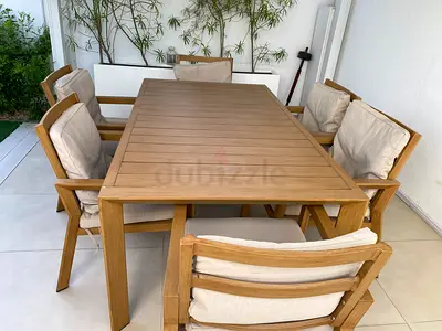 Solid Teak Outdoor Dining Table with 6 Cushioned Chairs - Good Condition