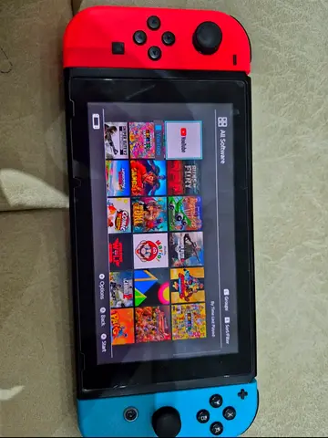 Nintendo switch with 30 games and 2 controllers available for sale at 1900
