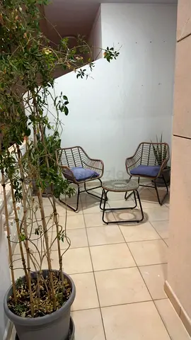 Outdoor rattan-style 2-seater patio set with glass table