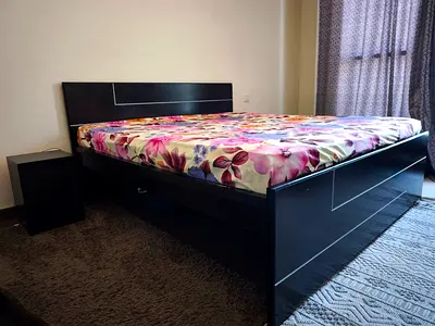 Queen size wooden bed frame with mattress and large under-bed storage - AED 600