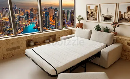 Light gray fabric sofa bed with pull-out mattress — good condition