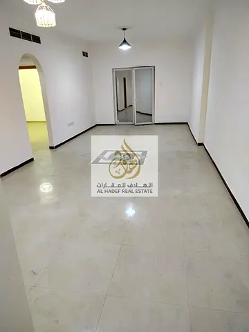 Annual rent in Ajman, Al Nuaimiya 3 area, near Dubai Islamic Bank. Two bedrooms, living room with balcony, central air conditioning, two bathrooms, ma