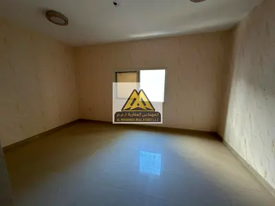 The unit features a practical layout, a separate kitchen, and a prime location close to all essential services, with easy access to Sharjah and Dubai,