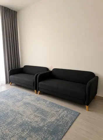 Matching Pair of Modern Charcoal Grey Sofas – 2 for 500 AED