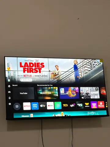 50 Wall-mounted smart LED TV in good condition (working) with small stand unit